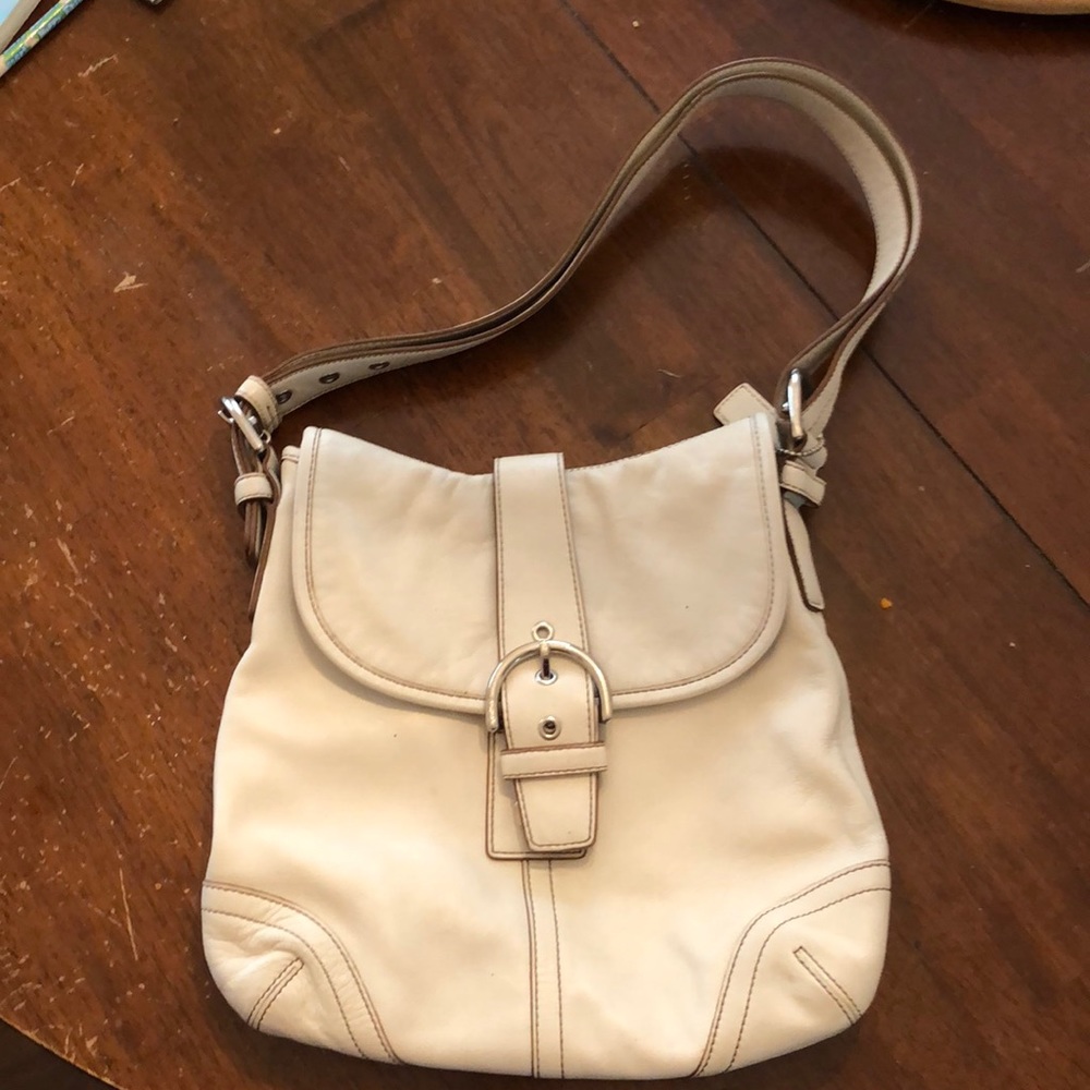White Coach shoulder bag.